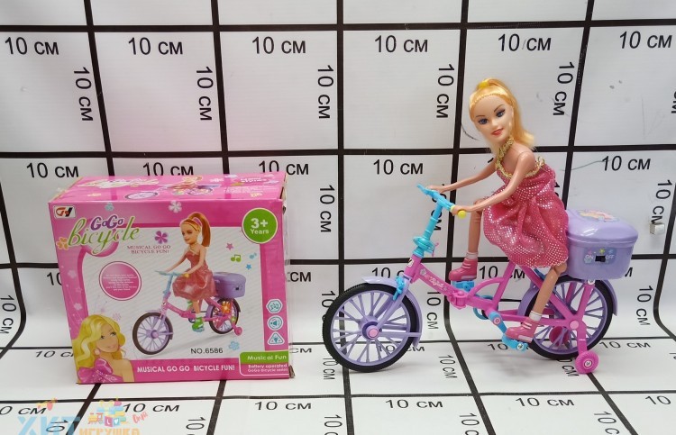 Кукла на велосипеде 6586